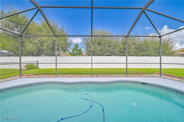 view of pool featuring a yard and a lanai