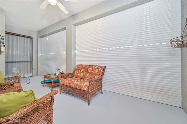 sitting room with ceiling fan