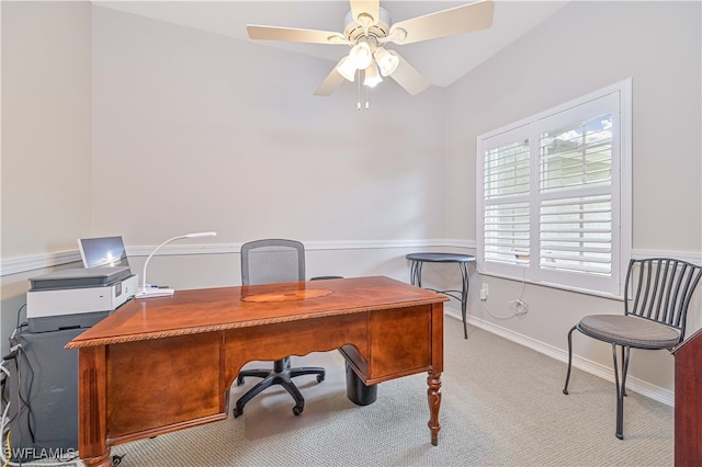 carpeted office space with ceiling fan