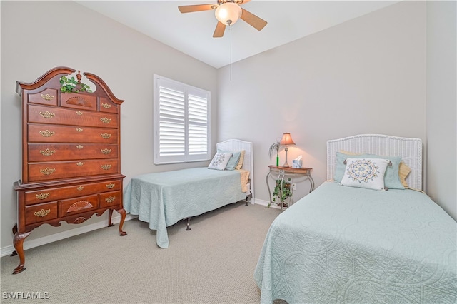 bedroom with ceiling fan and carpet flooring