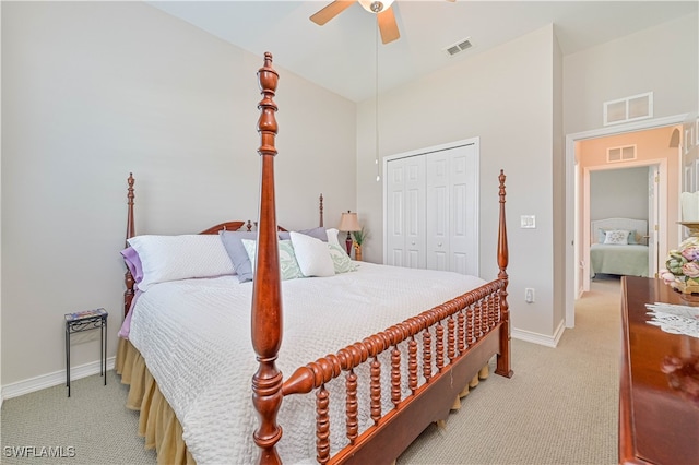 carpeted bedroom featuring a closet and ceiling fan