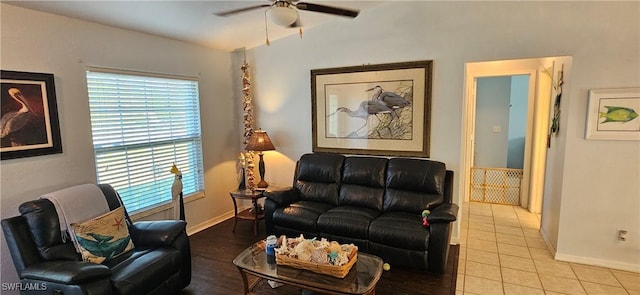 tiled living room with ceiling fan and a healthy amount of sunlight