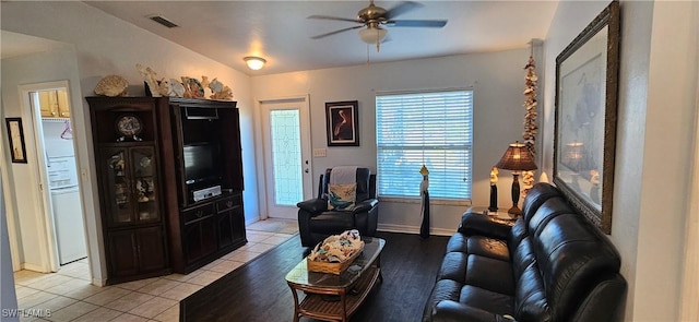 living room featuring ceiling fan and light tile patterned flooring