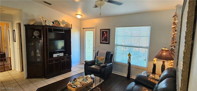 living room featuring ceiling fan and light tile patterned floors