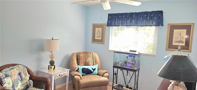 living area featuring ceiling fan