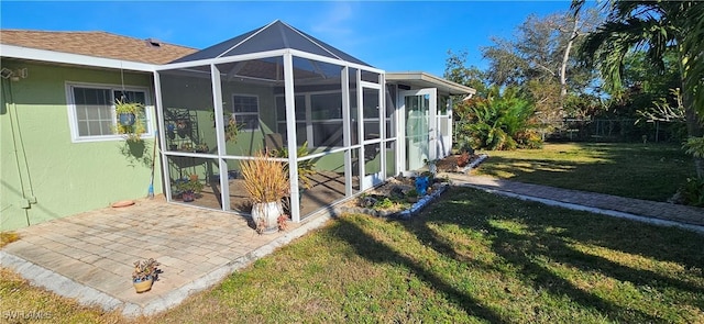 view of property exterior with a lawn and a patio area