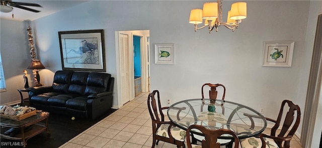 dining area with ceiling fan with notable chandelier and light tile patterned floors