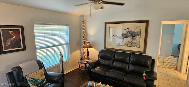 tiled living room featuring ceiling fan