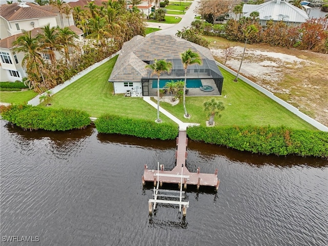 drone / aerial view with a water view