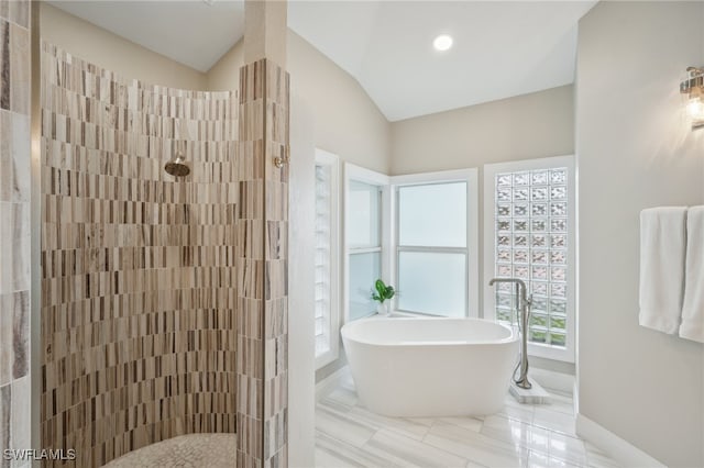 bathroom with independent shower and bath and lofted ceiling