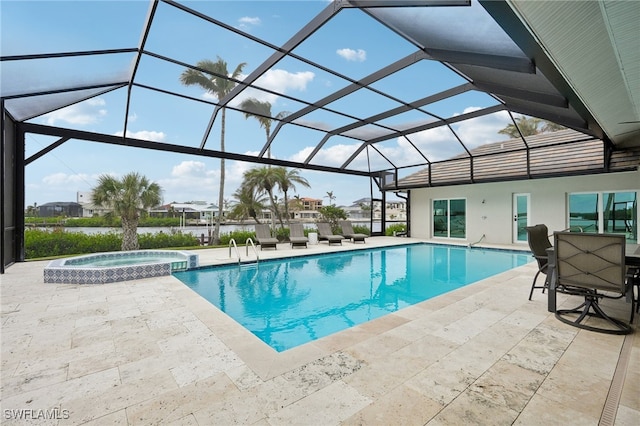 view of swimming pool featuring a patio, an in ground hot tub, and glass enclosure