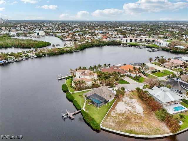 birds eye view of property featuring a water view