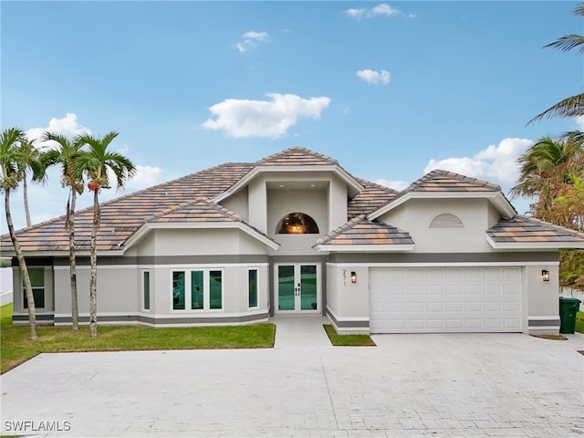 view of front of home featuring french doors and a garage