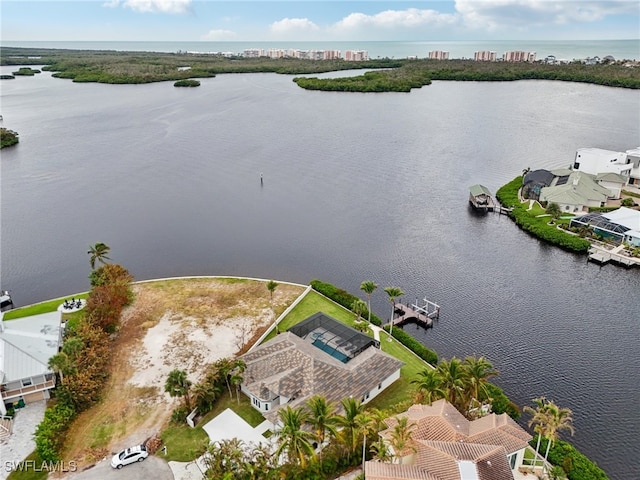 birds eye view of property featuring a water view