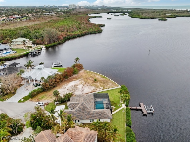 birds eye view of property featuring a water view