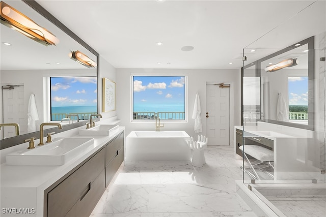 bathroom featuring vanity, plus walk in shower, and a water view