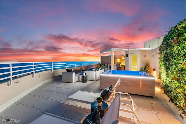 patio terrace at dusk with an outdoor hangout area