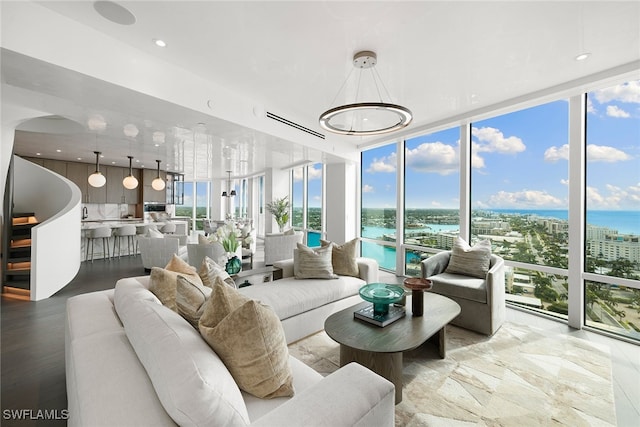 sunroom / solarium with a water view