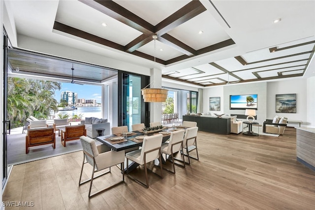 dining area with coffered ceiling, hardwood / wood-style floors, and beam ceiling