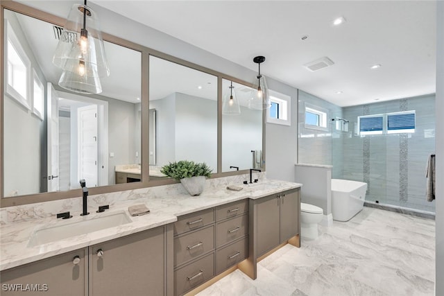 bathroom with shower with separate bathtub and vanity