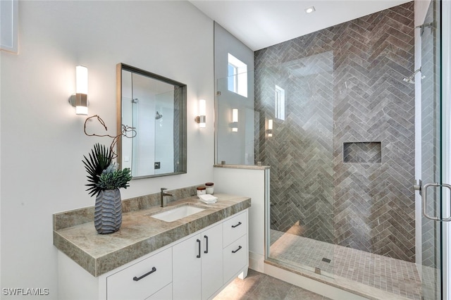 bathroom with vanity and an enclosed shower