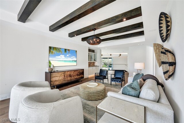 living room with wood-type flooring and beamed ceiling