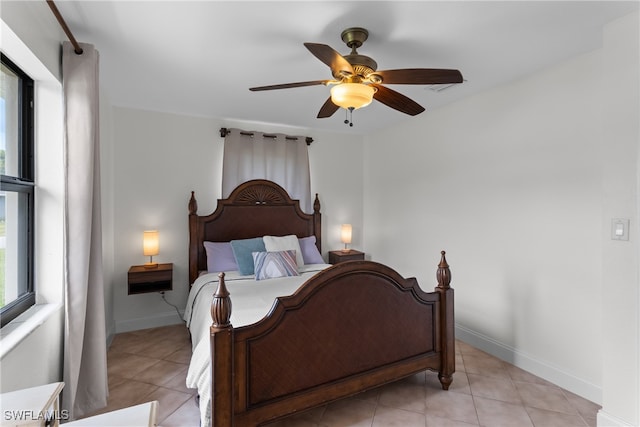 bedroom with light tile patterned floors and ceiling fan