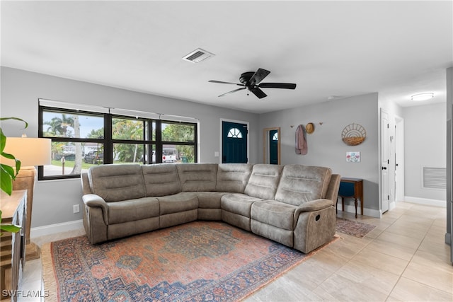 living room featuring light tile patterned flooring and ceiling fan