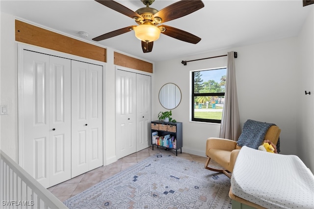 sitting room with ceiling fan and light tile patterned floors