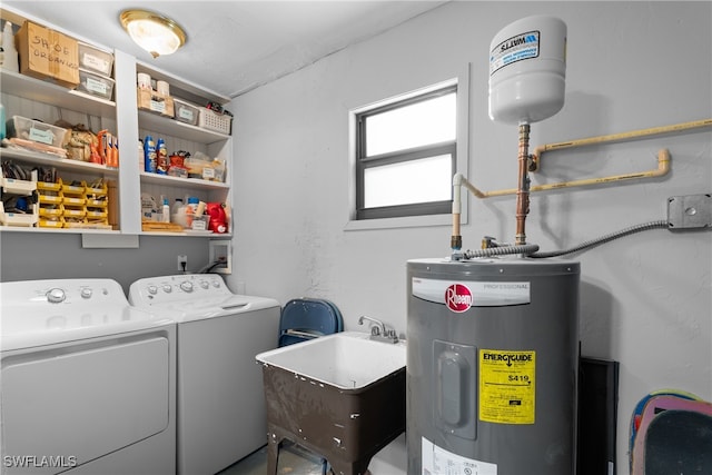 washroom with sink, washer and clothes dryer, and electric water heater