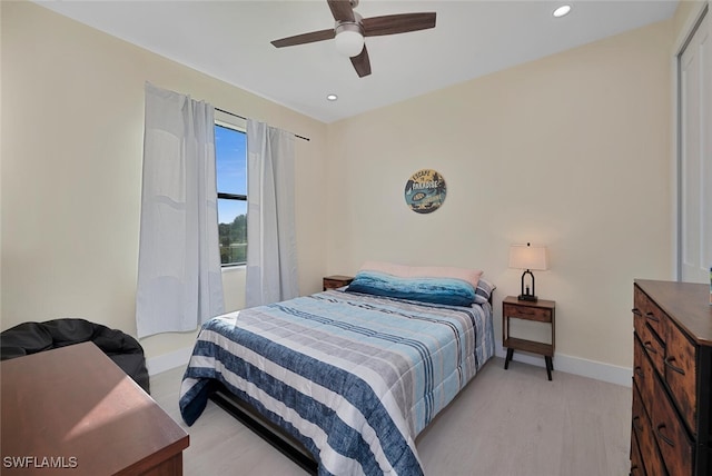 bedroom featuring ceiling fan and light wood-type flooring