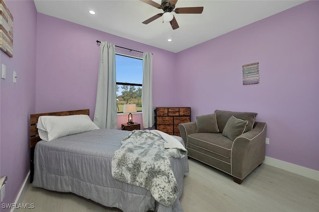 bedroom featuring light wood-type flooring and ceiling fan