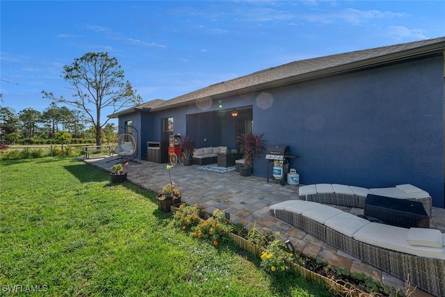 exterior space with a patio area, an outdoor hangout area, and a yard