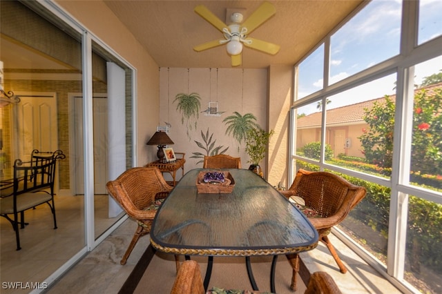 sunroom / solarium featuring ceiling fan