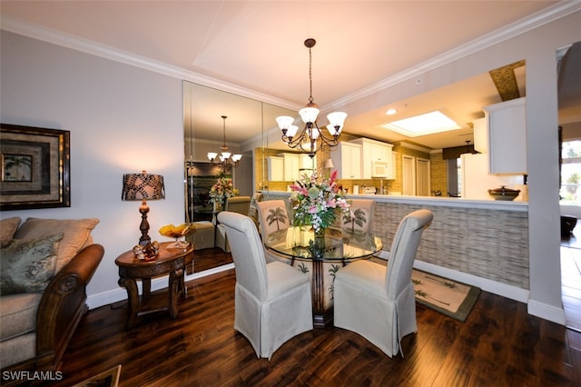 dining room featuring a notable chandelier, ornamental molding, and dark hardwood / wood-style flooring