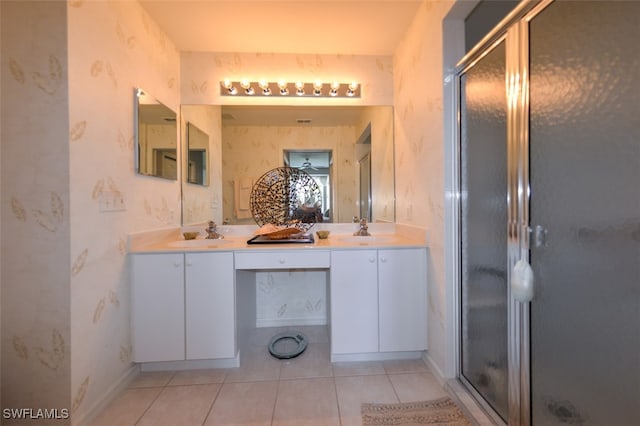 bathroom with vanity, tile patterned floors, and a shower with door