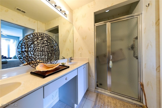 bathroom featuring vanity, ceiling fan, walk in shower, and tile patterned floors