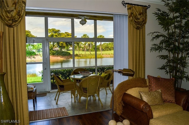 sunroom / solarium with a wealth of natural light and a water view