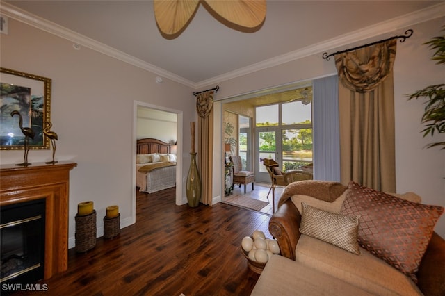 living room featuring ornamental molding and dark hardwood / wood-style flooring