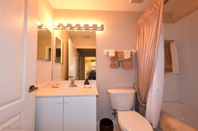 full bathroom with vanity, toilet, and shower / tub combo with curtain