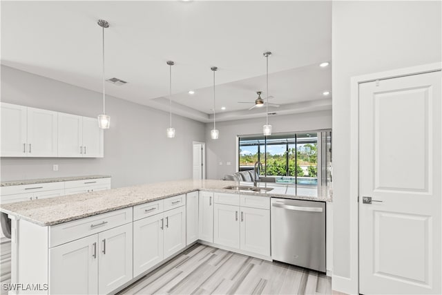 kitchen with ceiling fan, white cabinetry, stainless steel dishwasher, and sink