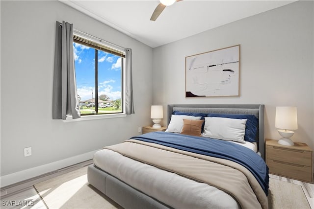 bedroom featuring ceiling fan and light hardwood / wood-style floors