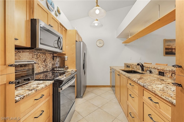 kitchen featuring sink, light tile patterned flooring, hanging light fixtures, stainless steel appliances, and vaulted ceiling