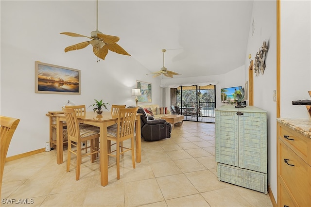 tiled dining room featuring high vaulted ceiling and ceiling fan