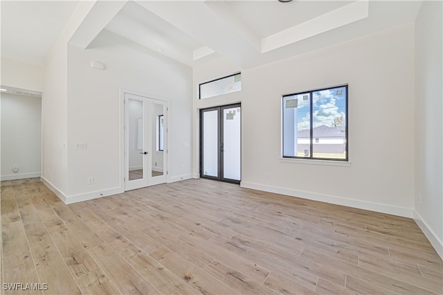 entryway with light hardwood / wood-style flooring and french doors