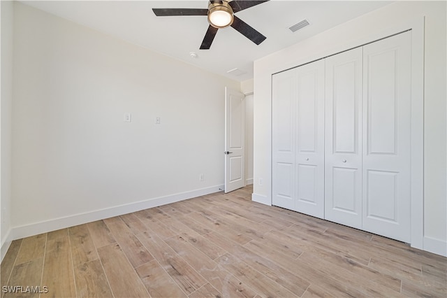 unfurnished bedroom featuring a closet, ceiling fan, and light hardwood / wood-style flooring