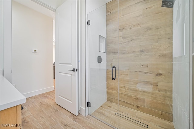 bathroom featuring vanity and walk in shower