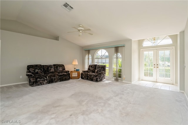 unfurnished room with french doors, lofted ceiling, plenty of natural light, and light colored carpet