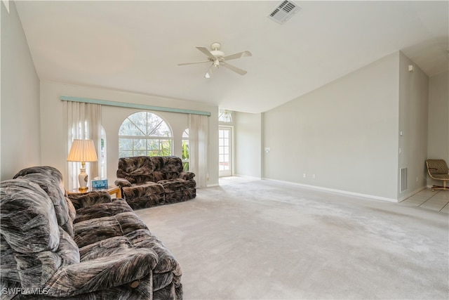 carpeted living room with vaulted ceiling and ceiling fan