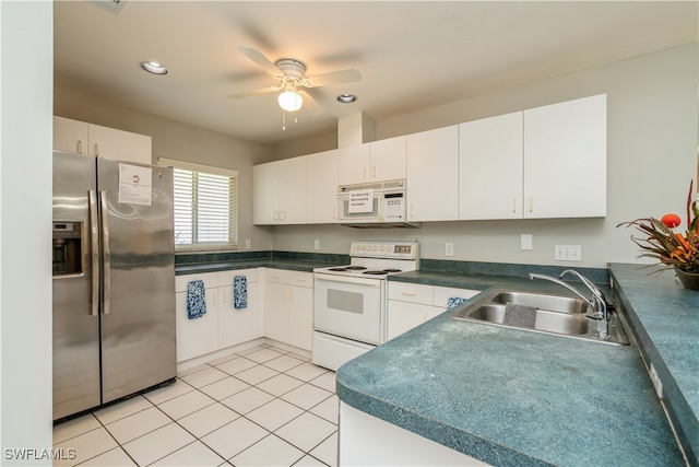 kitchen with sink, white cabinetry, and white appliances